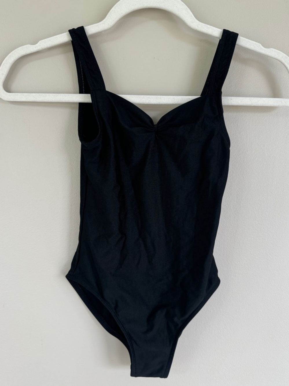 “Dancer’s bundle” 2 black leotards size 7/8 girls and one pink hair bow